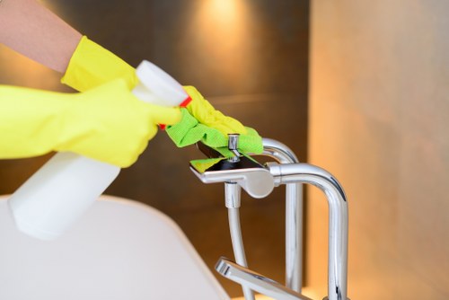 Experienced cleaner ensuring a fresh and organized room