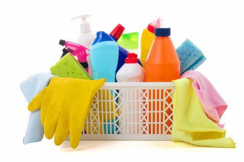 Edgware cleaning team member using protective gloves and cleaning supplies